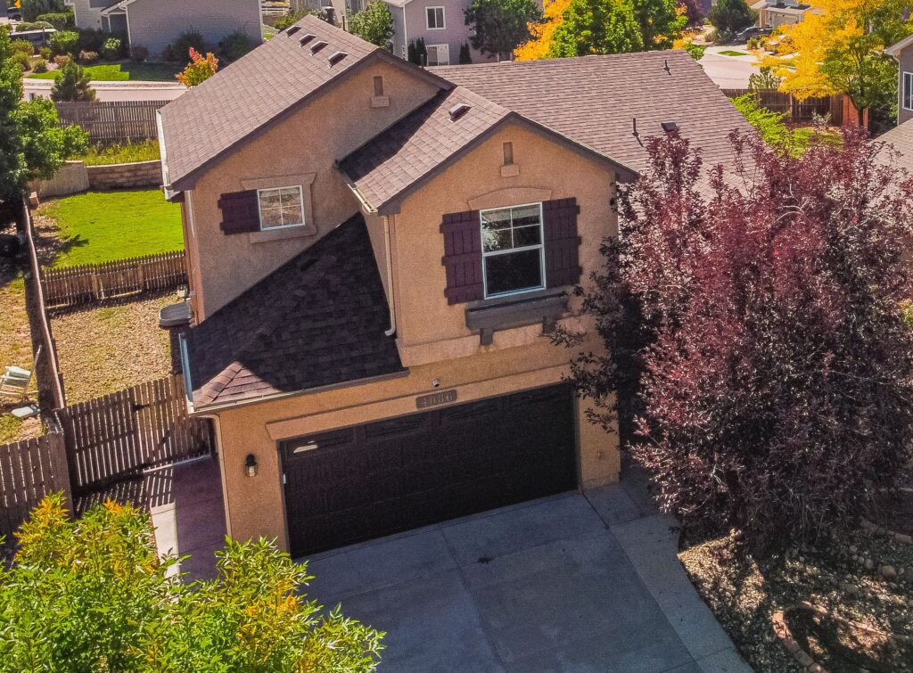 Photo of the front of the home featuring a large tree